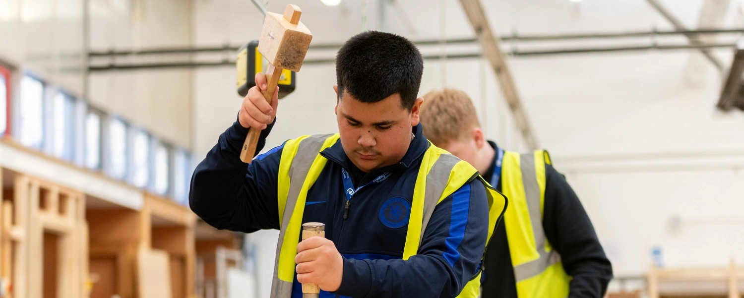Carpentry student with tools